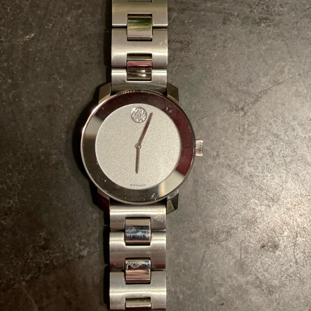 Movado woman’s silver watch.